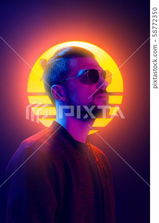 Retrowave synthwave portrait of a young man vaporwave. 80s sci-fi futuristic fashion poster style violet neon. Retrowave synthwave portrait of a young man vaporwave. 80s sci-fi futuristic fashion poster style violet neon. 58772350
