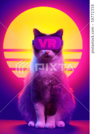 Cat wearing virtual reality goggles wireless headset. VR videogame experience in 80's synth wave and retro vaporwave futuristic aesthetics. 58772358