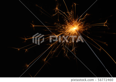 Sparkler isolated on black background. Burning bengal fire christmas party element. Sparkler isolated on black background. Burning bengal fire christmas party element. 58772460