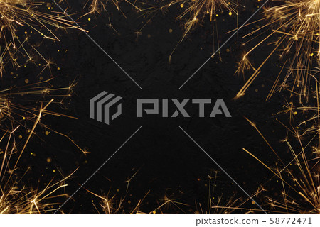 Festive burning sparklers with sparks background. Burning bengal fire with glitter particles frame. Party invitation poster template. Festive burning sparklers with sparks background. Burning bengal fire with glitter particles frame. Party invitation poster template. 58772471