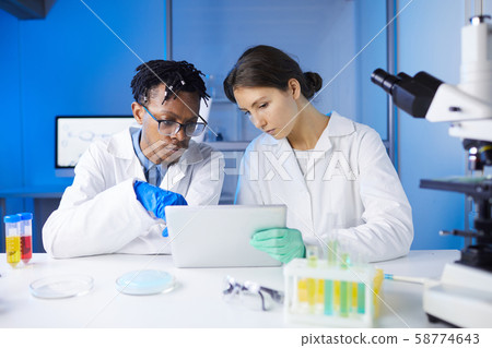 Team of Young Scientists in Laboratory 58774643