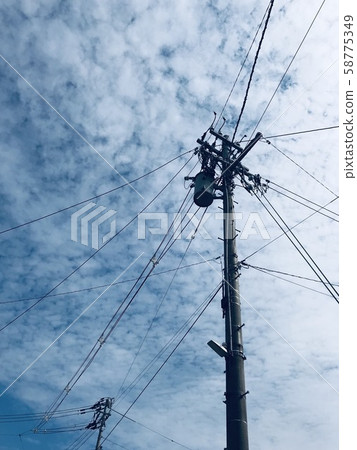 Utility poles and blue sky Utility poles and blue sky 58775349