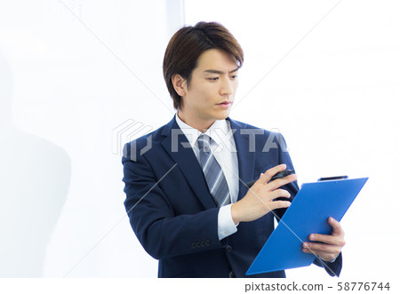 Young man working 58776744