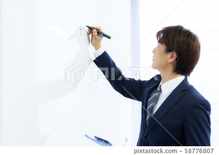 Young man working Young man working 58776807