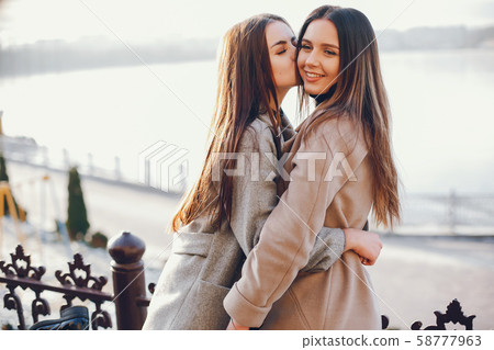 Two stylish girls have a rest in a city 58777963