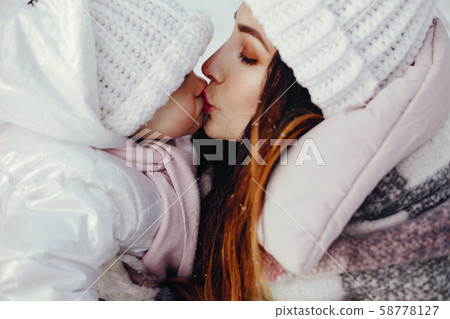 Mother and daughter in a winter park Mother and daughter in a winter park 58778127