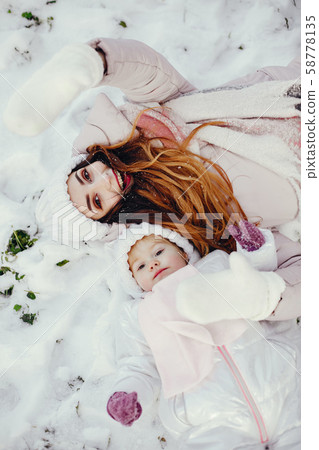 Mother and daughter in a winter park Mother and daughter in a winter park 58778135
