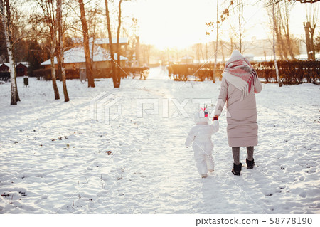 Mother and daughter in a winter park Mother and daughter in a winter park 58778190