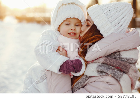 Mother and daughter in a winter park Mother and daughter in a winter park 58778193