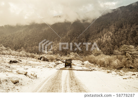 Off-road SUV driving on the rock mountain road Off-road SUV driving on the rock mountain road 58778287