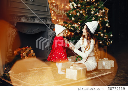 Mother with cute daughter at home Mother with cute daughter at home 58779539
