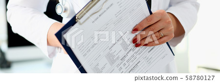 Female doctor hand holding and filling patient Female doctor hand holding and filling patient 58780127
