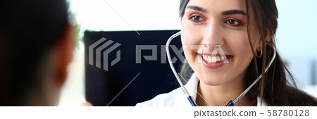 Beautiful smiling female doctor hold in arm Beautiful smiling female doctor hold in arm 58780128