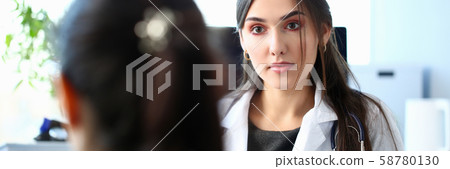 Smiling beautiful female medicine doctor explain diagnosis Smiling beautiful female medicine doctor explain diagnosis 58780130