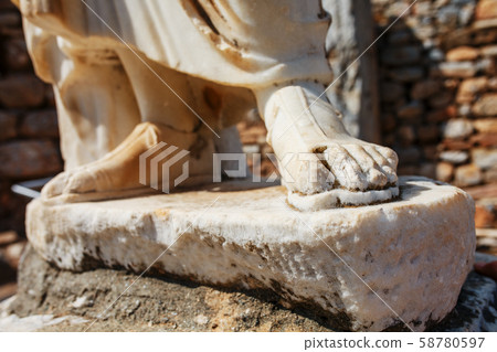 Elements of marble legs of an ancient statue of Elements of marble legs of an ancient statue of 58780597
