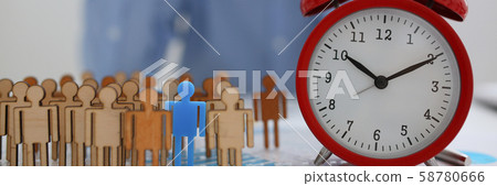 Businessman with his hand puts a miniature silhouette 58780666