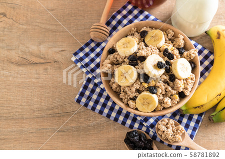 granola with banana, raisin and milk granola with banana, raisin and milk 58781892