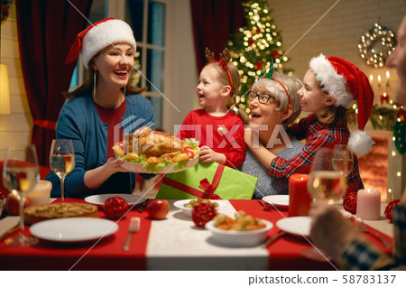 family celebrating Christmas family celebrating Christmas 58783137