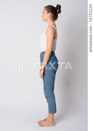 Full body shot profile view of young beautiful woman 58783229