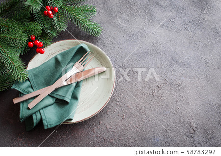 Festive table setting. Winter table set for Christmas or New Year dinner.  58783292