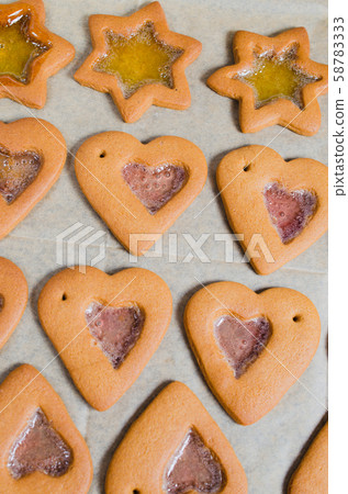 Freshly baked Christmas gingerbread ready to decorate with icing.  58783333