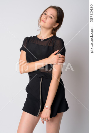 Portrait of young beautiful woman with hair tied posing Portrait of young beautiful woman with hair tied posing 58783480