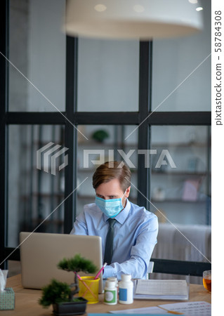 Interior designer finishing project even having flu 58784308