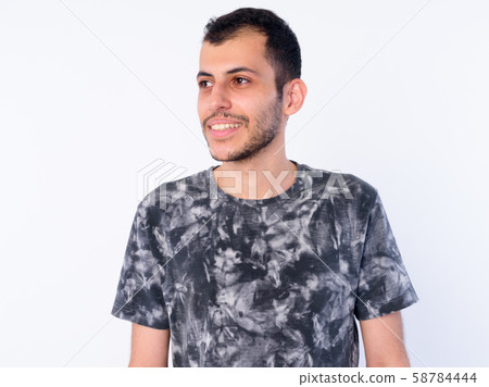 Face of happy young bearded Persian man thinking Face of happy young bearded Persian man thinking 58784444