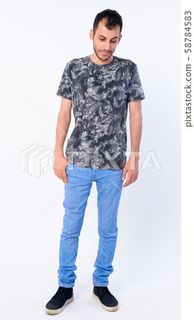 Full body shot of young bearded Persian man looking down Full body shot of young bearded Persian man looking down 58784583