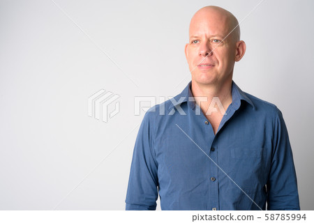 Face of mature handsome bald businessman thinking Face of mature handsome bald businessman thinking 58785994