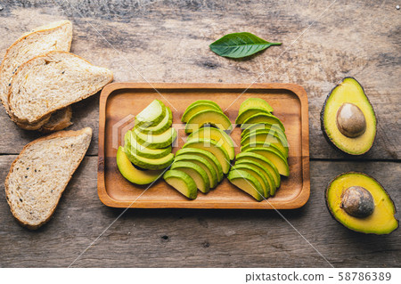 Avocado,Avocado in a wooden basket,breakfast Avocado,Avocado in a wooden basket,breakfast 58786389