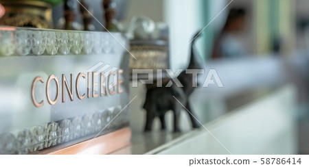 Concierge service counter of hotel, restaurant or apartment's front desk in luxury reception hall in Thailand with staff working for serving tourist guest or check-in customers 58786414