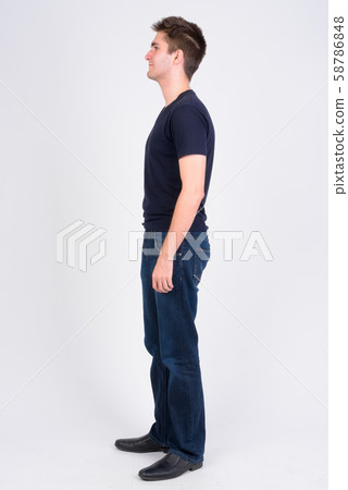Full body shot profile view of young handsome man 58786848