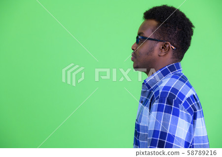 Profile view of young African hipster man with eyeglasses 58789216