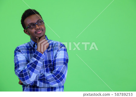 Young African hipster man with eyeglasses thinking 58789253