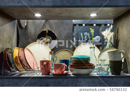 a showcase with the laying of porcelain dishes. Beautiful merchandising, dishes for restaurants and 58790132