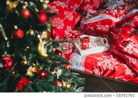 Interior with Christmas tree in a cozy bedroom. 58791761