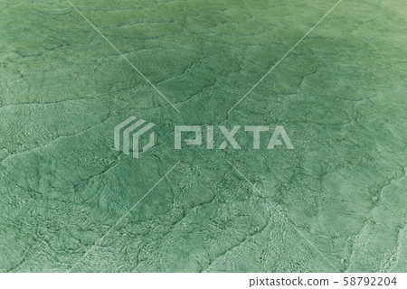 Pattern of sea waves toned in green shades Pattern of sea waves toned in green shades 58792204
