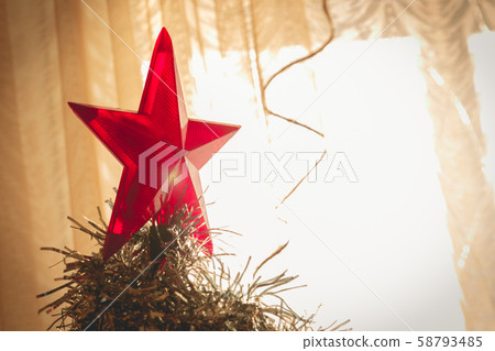Decorated Christmas tree. Big red star on top of Decorated Christmas tree. Big red star on top of 58793485