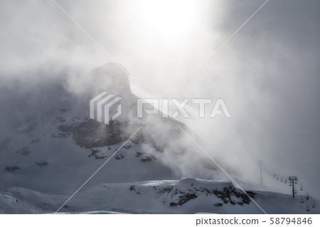 In the clouds at the top of the mountains 58794846