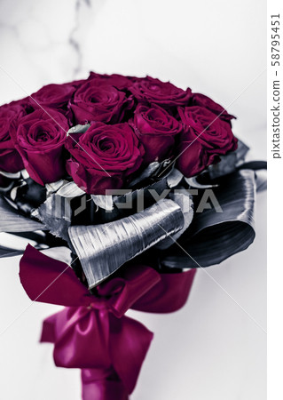 Luxury bouquet of maroon roses on marble 58795451