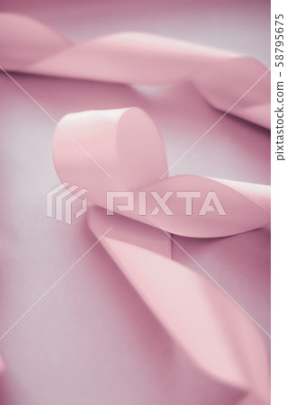 Abstract silk ribbon on blush pink background, 58795675