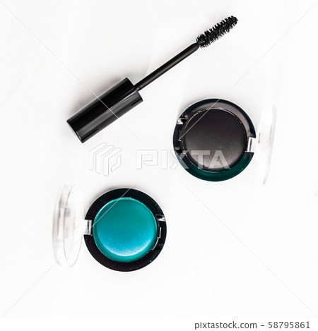 Eyeshadows, black liner and mascara on marble Eyeshadows, black liner and mascara on marble 58795861