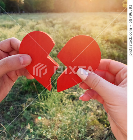 Loving couple joins together the halves Loving couple joins together the halves 58796393