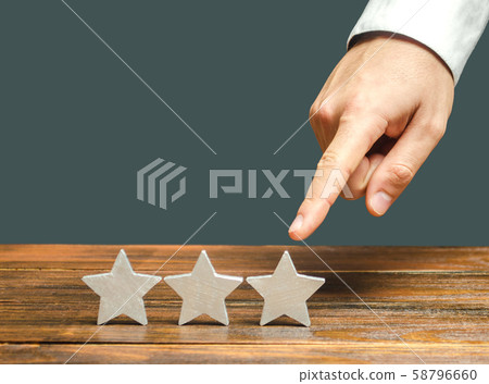 Critic points to third star.  58796660