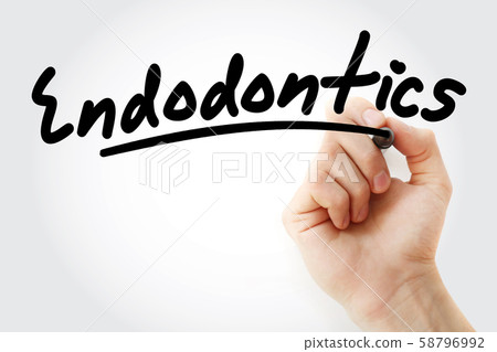 Hand writing Endodontics with marker 58796992