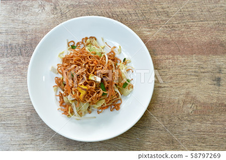 fried instant noodles with tofu and garlic chive on plate 58797269