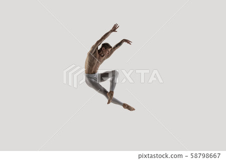 Modern ballet dancer. Contemporary art ballet. Young flexible athletic man. Modern ballet dancer. Contemporary art ballet. Young flexible athletic man. 58798667