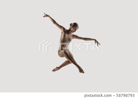 Modern ballet dancer. Contemporary art ballet. Young flexible athletic woman. Modern ballet dancer. Contemporary art ballet. Young flexible athletic woman. 58798793
