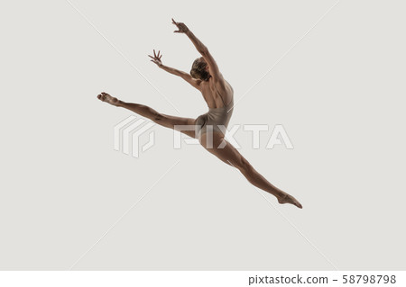 Modern ballet dancer. Contemporary art ballet. Young flexible athletic woman. 58798798